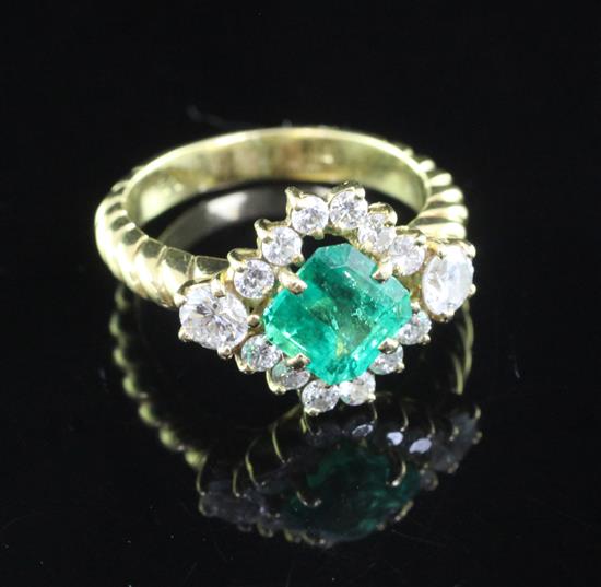 An 18ct gold, emerald and diamond cluster ring, size M.